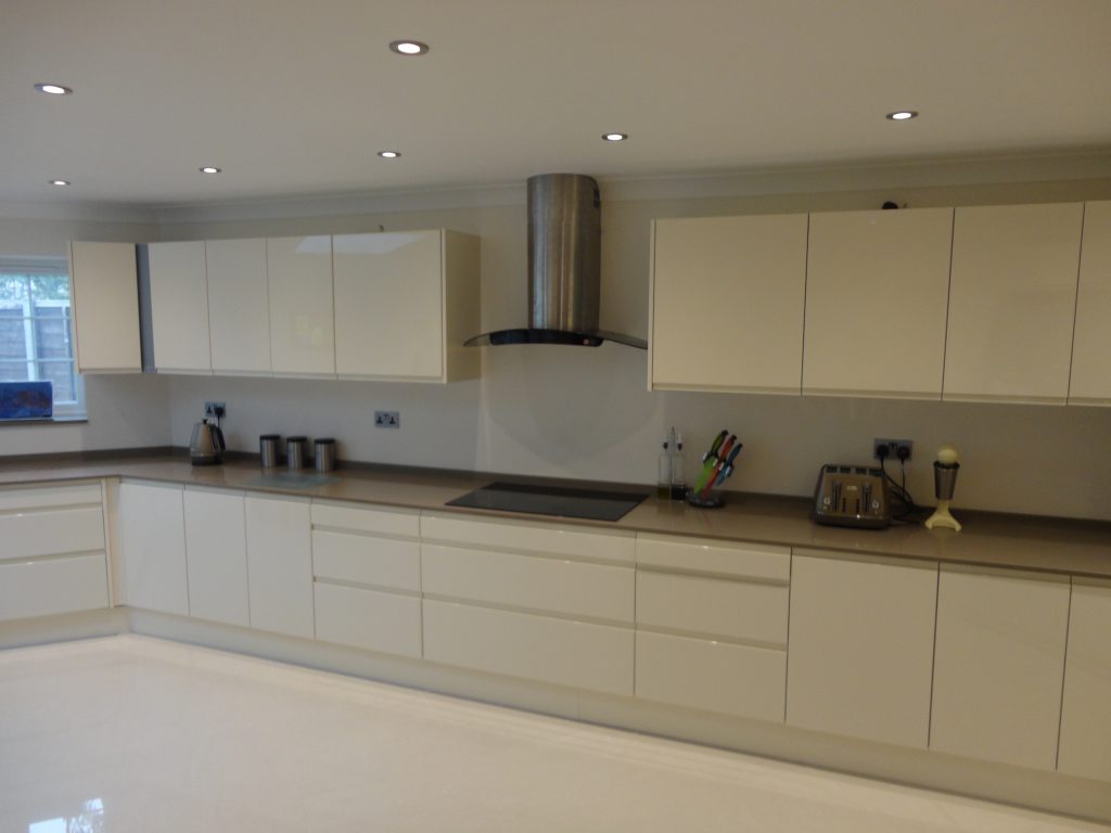 Kitchen hob, extractor and cupboards