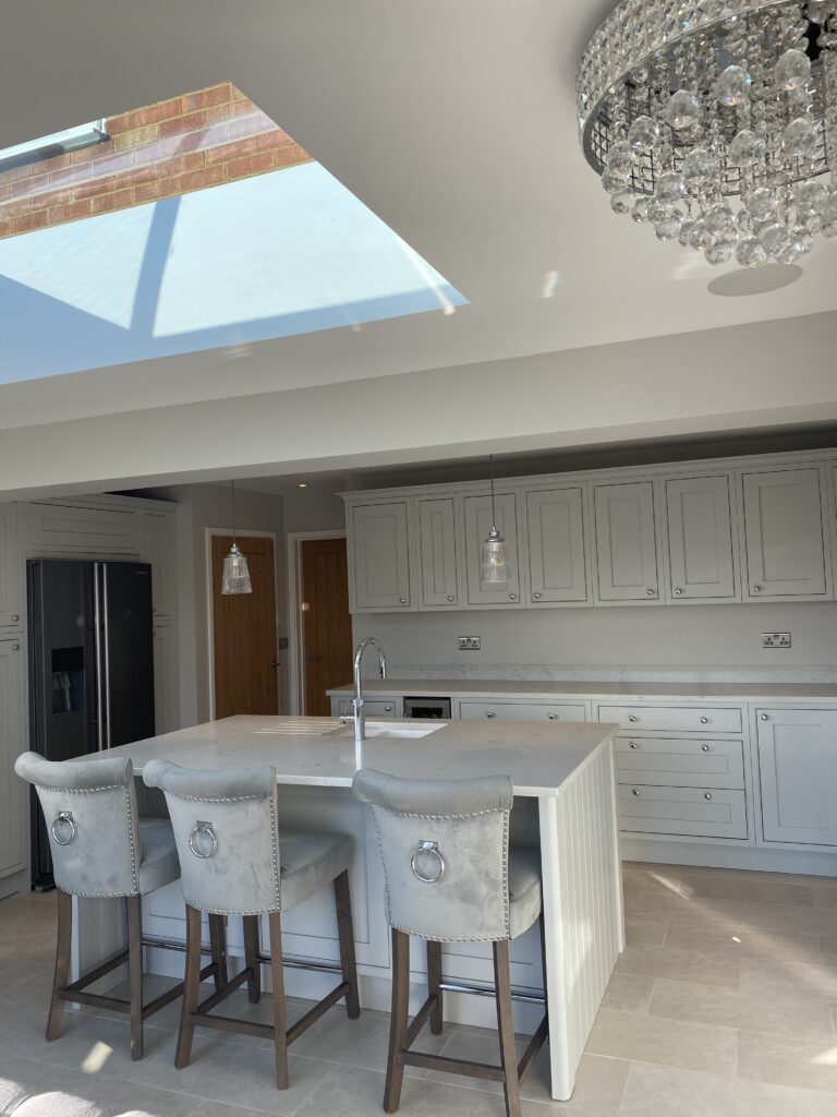Shaker style kitchen with white quartz worktop